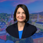 Headshot of Becca Balint with a picture of downtown Montpelier in the background