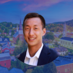 Headshot of Kevin Chu with a backdrop of downtown Montpelier